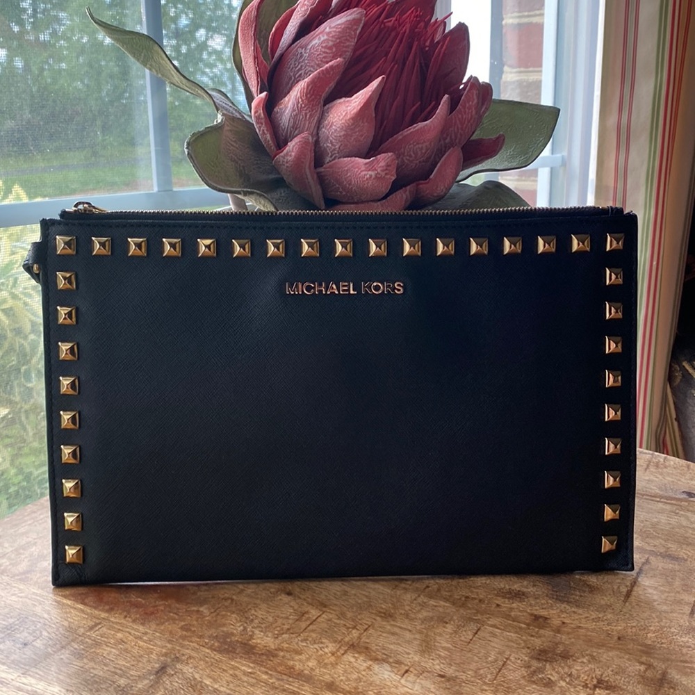 Michael Kors, black leather clutch with gold stud detail.